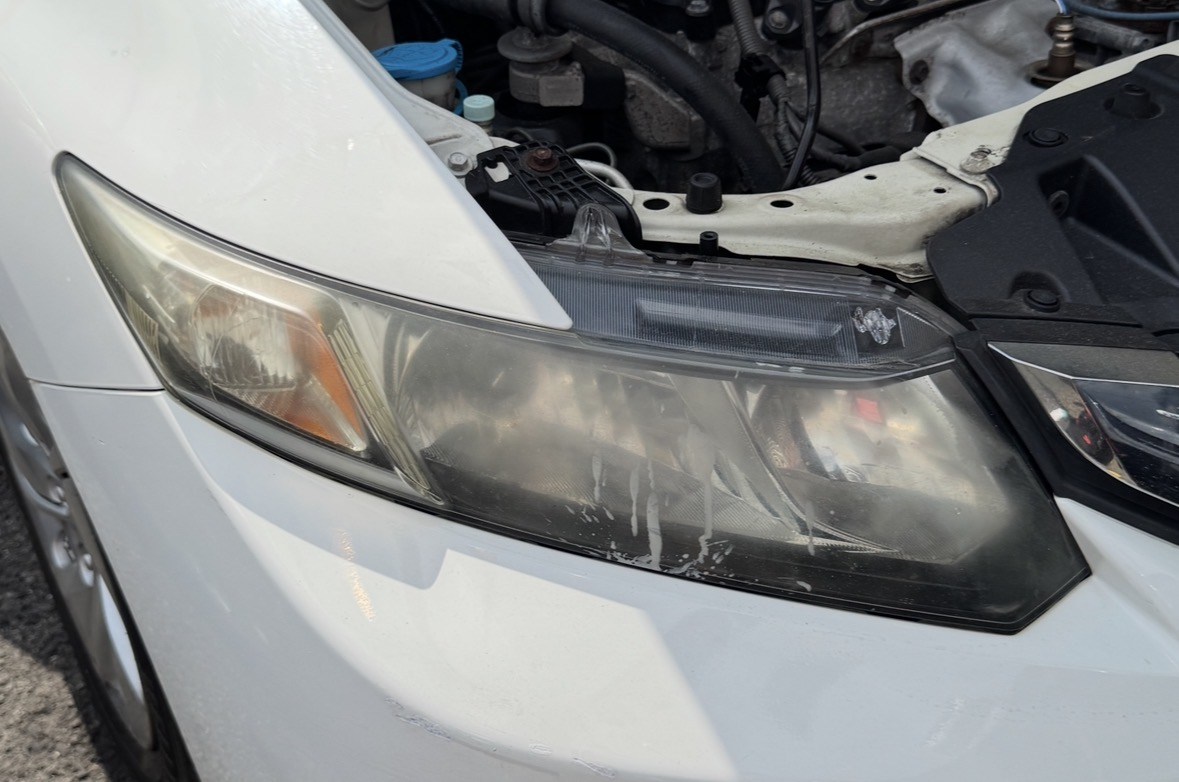 Cloudy oxidized Honda headlight before restoration